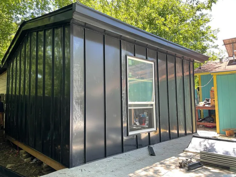 Black standing seam metal wall panels for Roof Inspection in Ensley